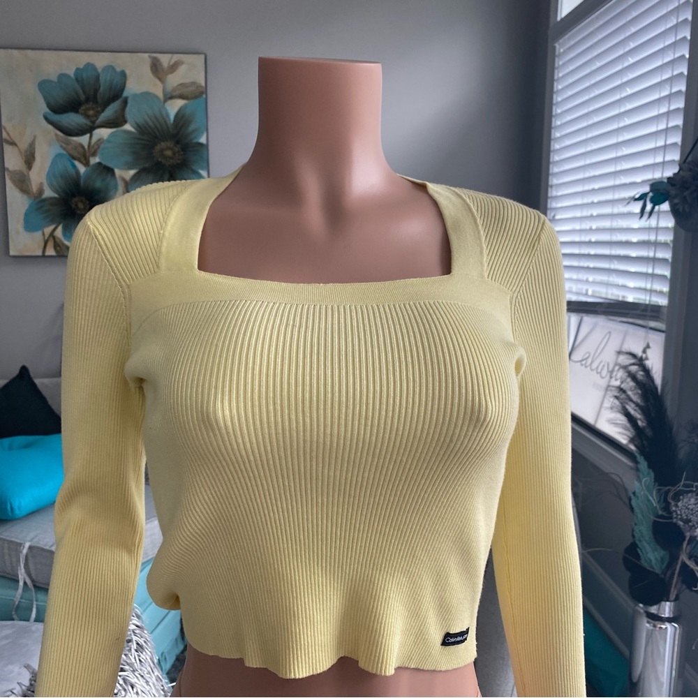 A long sleeve yellow shirt